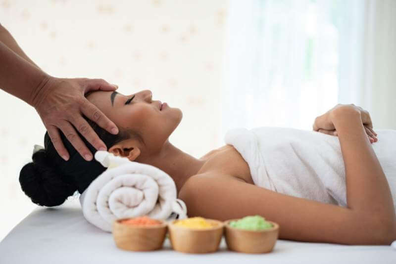 young-woman-enjoying-massage-in-spa-salon