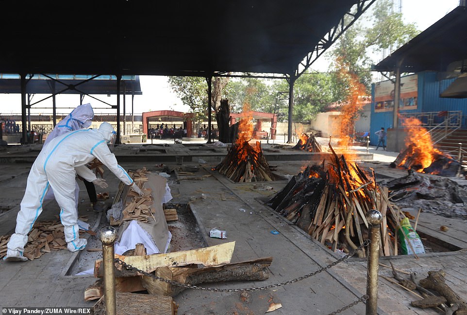 Burning pyres of patients who died of coronavirus at a crematorium in New Delhi